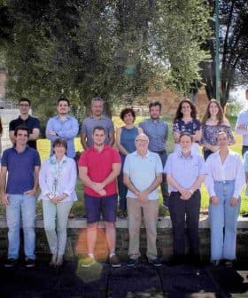 Group photo featuring members of UCOLIVO standing outdoors in a line. - Olive Oil Times