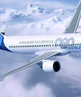 Airbus A320neo aircraft flying above the clouds with a blue and white livery. - Olive Oil Times