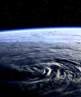A view of Earth from space showing swirling weather patterns and the curvature of the planet. - Olive Oil Times