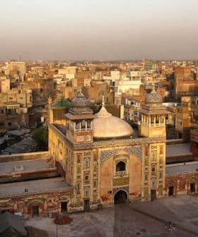 A historic mosque featuring intricate architecture and minarets in an urban landscape. - Olive Oil Times