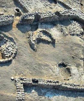 Aerial view of an archaeological site featuring various stone structures and formations. - Olive Oil Times