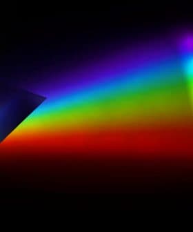 Light spectrum displayed through a prism, showing a range of colors from red to violet. - Olive Oil Times