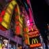 Illuminated McDonald's restaurant signage featuring the iconic golden arches at night. - Olive Oil Times