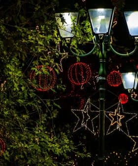 Street lamps adorned with decorative lights and ornaments during the holiday season. - Olive Oil Times