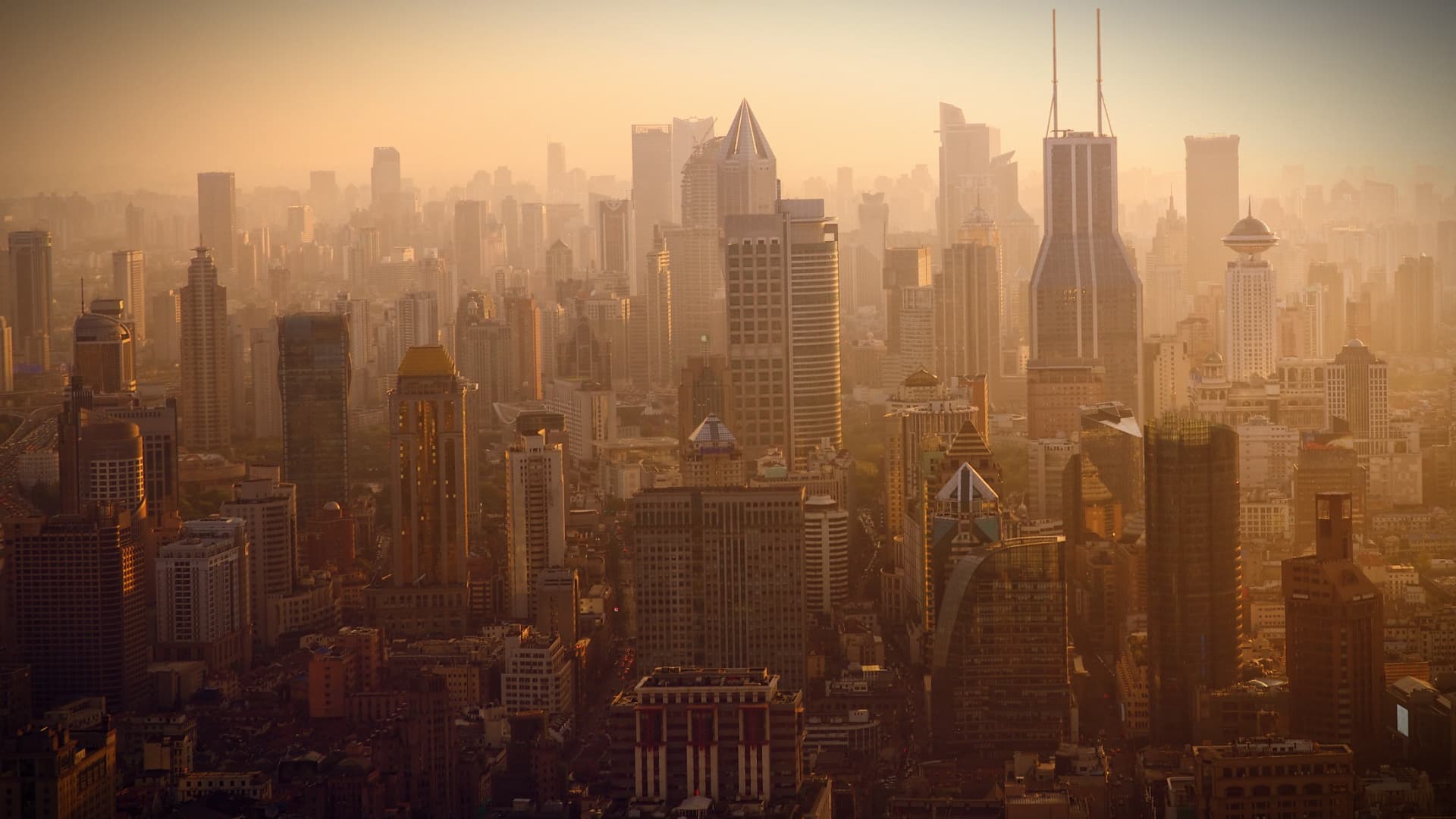 A panoramic view of Shanghai's skyline with skyscrapers during sunset. - Olive Oil Times