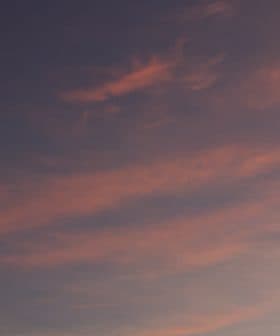 A sky filled with colorful clouds during sunset, featuring shades of pink and blue. - Olive Oil Times