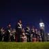 A group of ceremonial guards in uniform standing in formation at night with Big Ben in the background. - Olive Oil Times