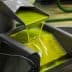 Fresh olive oil flowing from a machine during the extraction process in a production facility. - Olive Oil Times