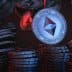 3D rendering of Ethereum coins stacked and floating in a dark background with red and blue lighting. - Olive Oil Times