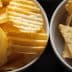 Two bowls containing potato chips and tortilla chips arranged side by side. - Olive Oil Times