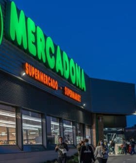 Exterior view of a Mercadona supermarket with illuminated signage during dusk. - Olive Oil Times