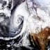 Satellite image showing a weather system swirling off the west coast of North America with cloud formations. - Olive Oil Times