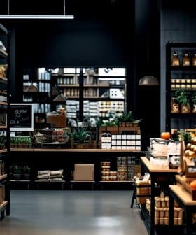 Interior view of a grocery store featuring shelves stocked with various food products and items. - Olive Oil Times