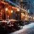 Outdoor dining area with tables and chairs on a snowy street during winter evening. - Olive Oil Times