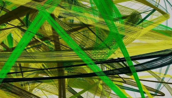 Abstract artwork featuring intersecting lines in green and yellow hues on a light background. - Olive Oil Times