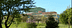 Building of the University of Ioannina partially obscured by trees and vegetation. - Olive Oil Times